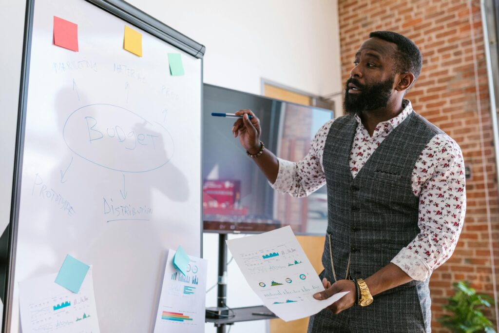 The Proven Path to BoI Funding Nigeria: Professional presentation focused on budget planning in an office environment.